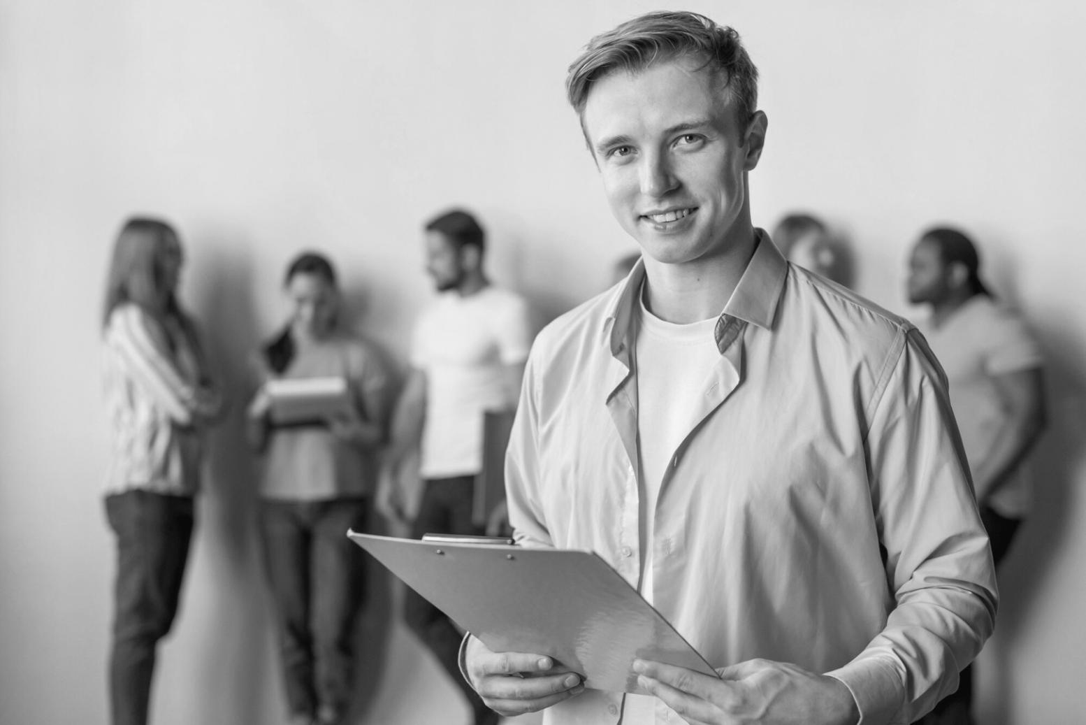Financial literacy workshop session showing participants working on budget planning exercises with calculators and worksheets